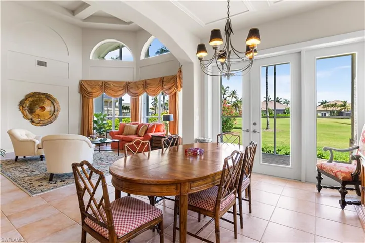 Your formal dining room has access to an additional screened in lanai that runs across the back of the home overlooking the golf course.