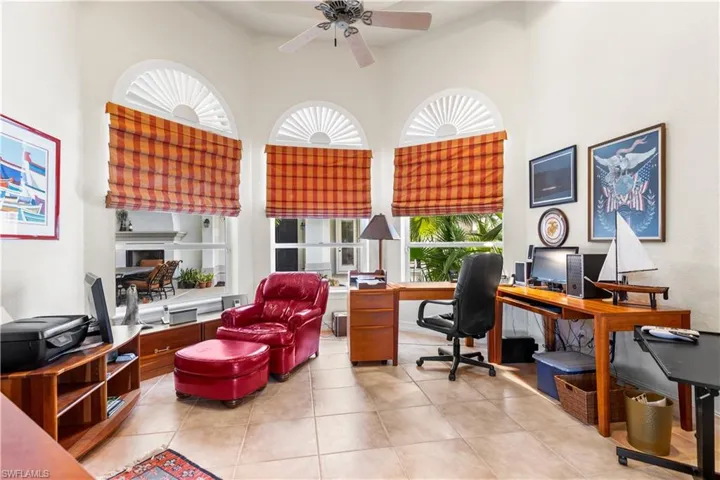 Your office/den overlooks the courtyard. Custom plantation shutters.