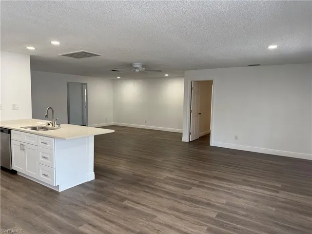 Kitchen featuring open floor plan, recessed lighting, a peninsula, ceiling fan, and stainless steel dishwasher