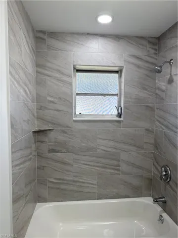 Bathroom featuring tub / shower combination