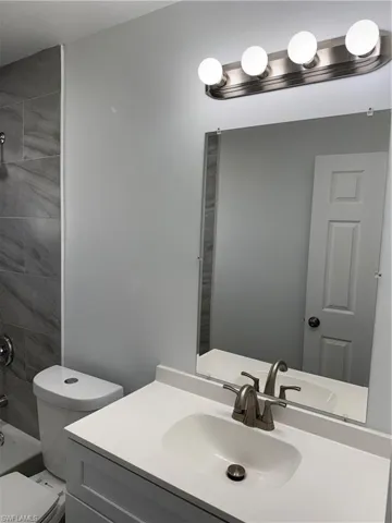 Bathroom featuring vanity and tub / shower combination
