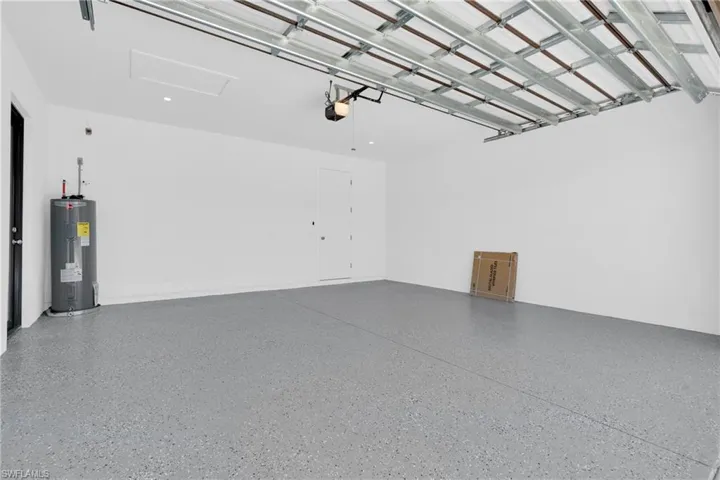 Garage featuring electric water heater