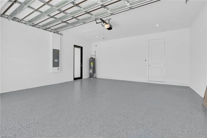 Garage with electric water heater and electric panel
