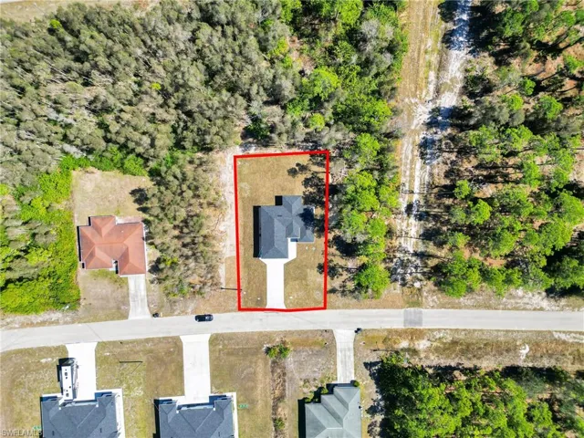 Aerial overview of property's location featuring property parcel outlined