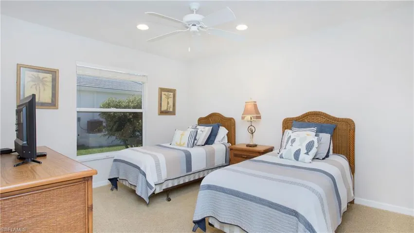 Bedroom with recessed lighting, light colored carpet, and ceiling fan