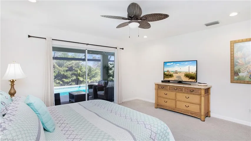 Bedroom featuring access to outside, light colored carpet, recessed lighting, and ceiling fan