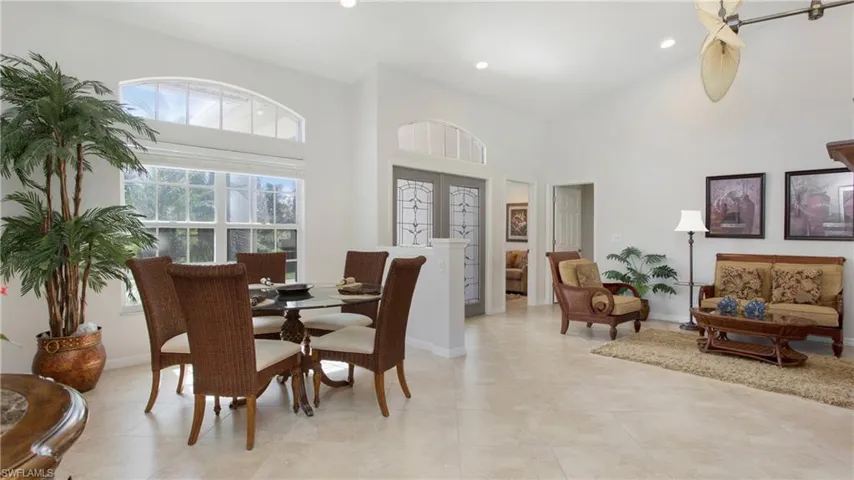 Dining room featuring a high ceiling and recessed lighting
