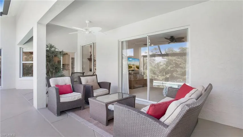 View of patio featuring ceiling fan and outdoor seating
