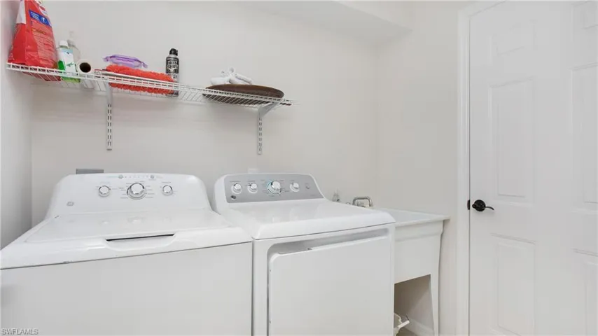 Laundry room featuring separate washer and dryer