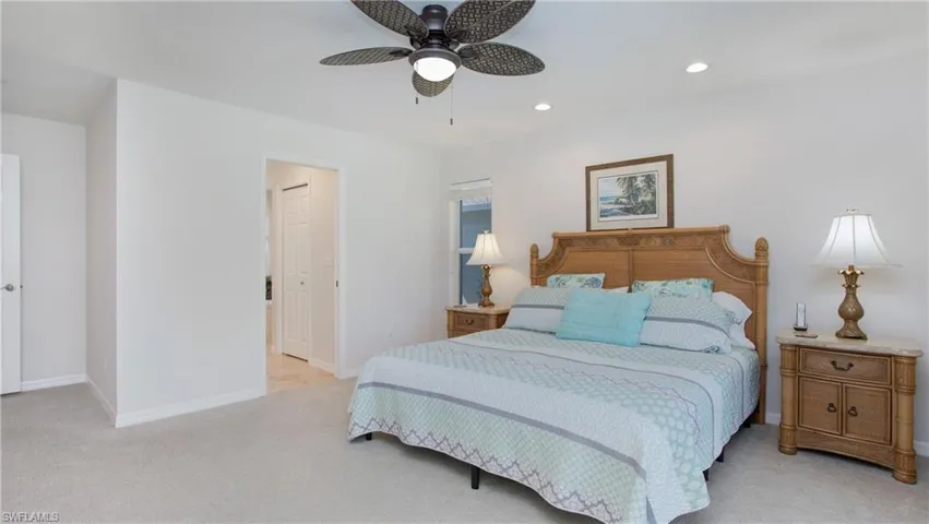 Bedroom with light carpet, recessed lighting, and ceiling fan