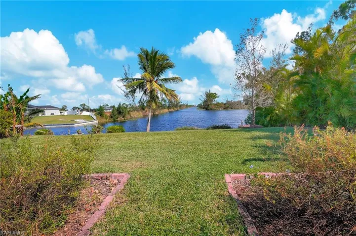 View of yard with a water view