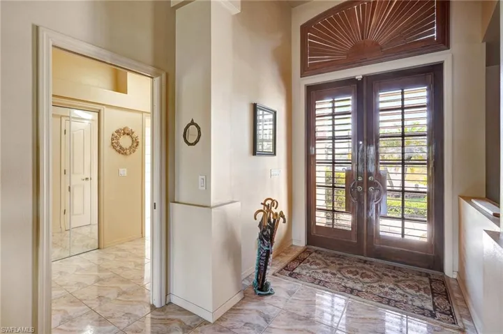 Entrance foyer featuring french doors