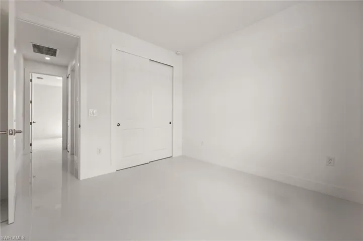 Unfurnished bedroom featuring a closet and light tile patterned floors