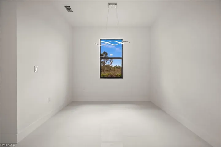 Unfurnished room with baseboards