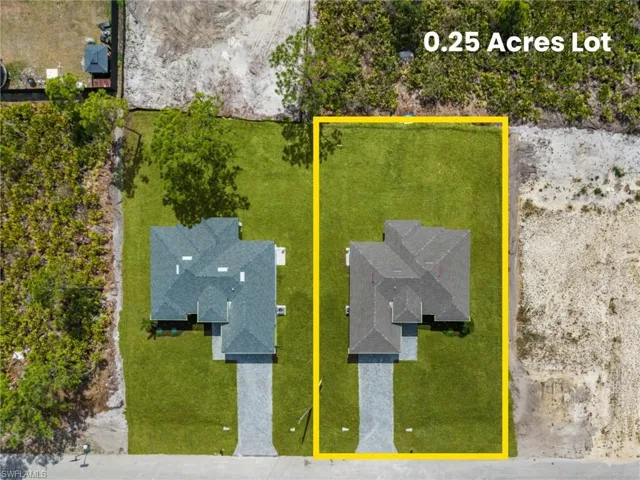 Aerial view of residential area with property boundaries highlighted