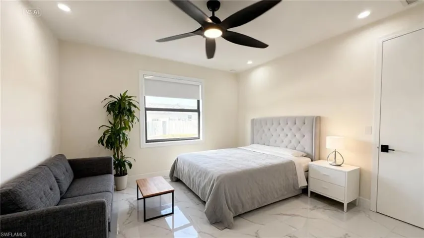 Bedroom with recessed lighting, light marble finish floors, and a ceiling fan
