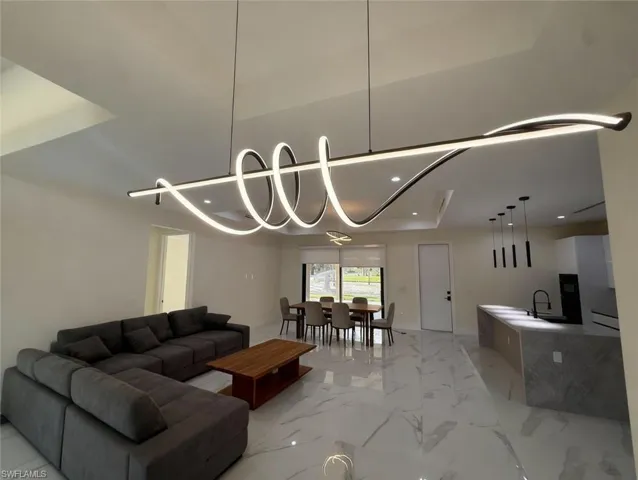 Living area featuring recessed lighting and baseboards
