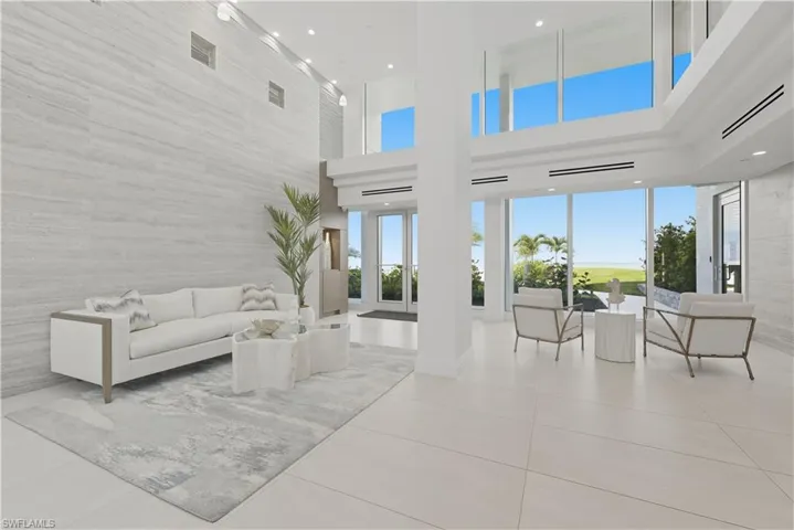 Lobby featuring recessed lighting and a towering ceiling