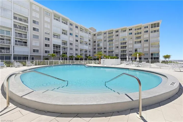 Community pool with a patio