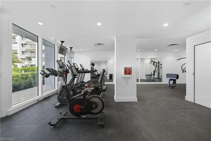 Workout area featuring recessed lighting
