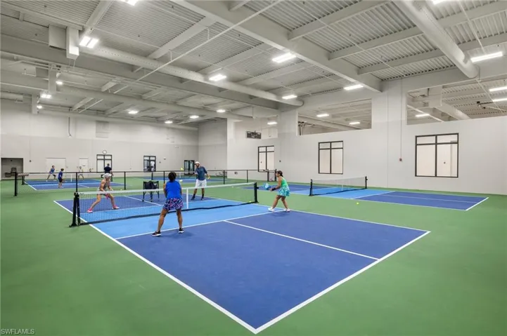 View of tennis court featuring basketball court