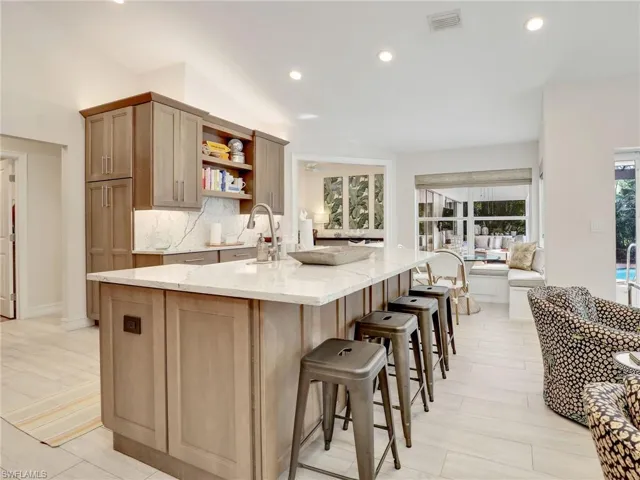 Kitchen with oversized island & pantry w/ pull outs