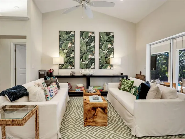 Family room with sliders to the lanai and doorway to the primary suite