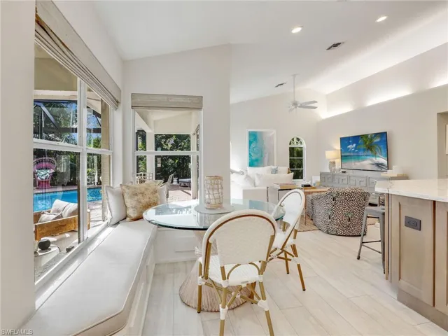 Dining area with built-in bench and windows to the lanai