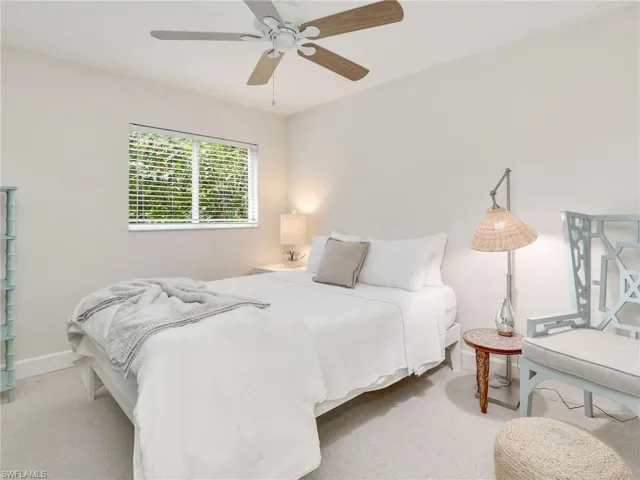 Guest bedroom w/ landscaped view
