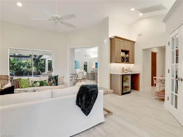 Family room in the front of the home with sliders to the lanai & dry bar w/ beverage center