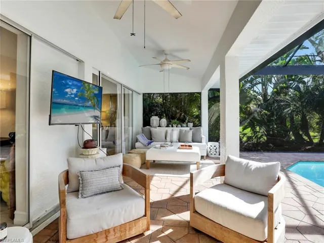 Covered lanai with sliders to the family room & primary bedroom