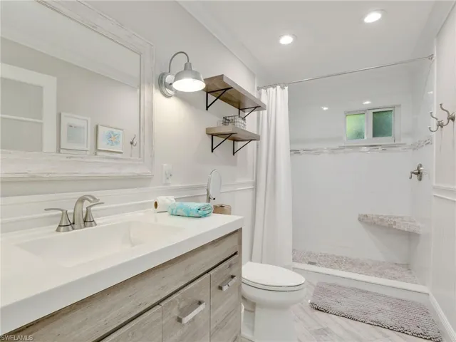 Guest bathroom w/ tiled walk in shower & upgraded vanity