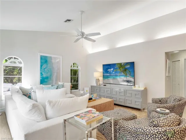 Living area w/ hallway to 2 guest bedrooms & bathroom