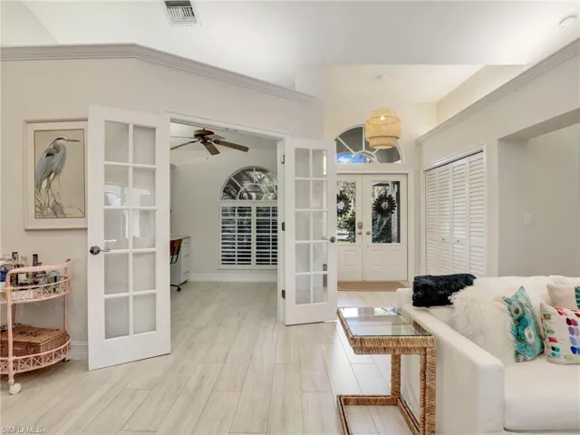Entry & french doors to the den