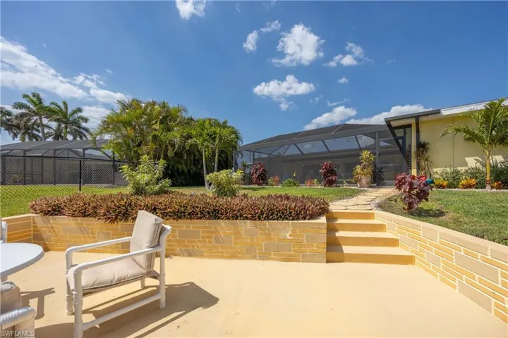 View of patio / terrace featuring glass enclosure