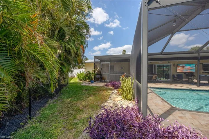 Pool featuring a yard, a patio, and a lanai