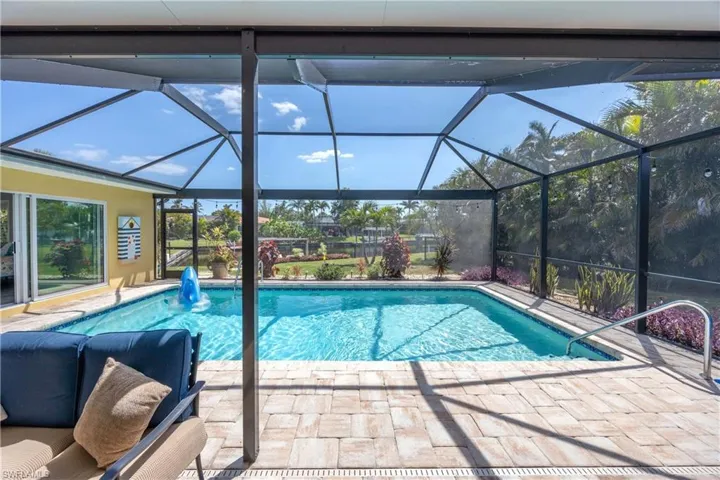 Pool with a patio and a lanai
