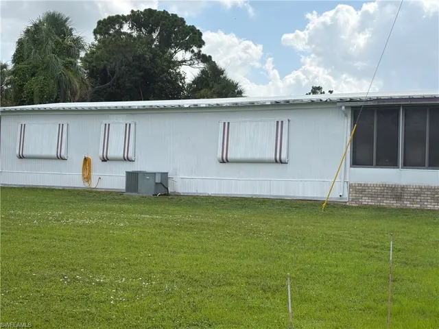 Side of Home Showing Closed Shutters