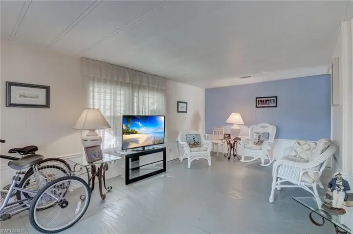 Living room featuring concrete flooring