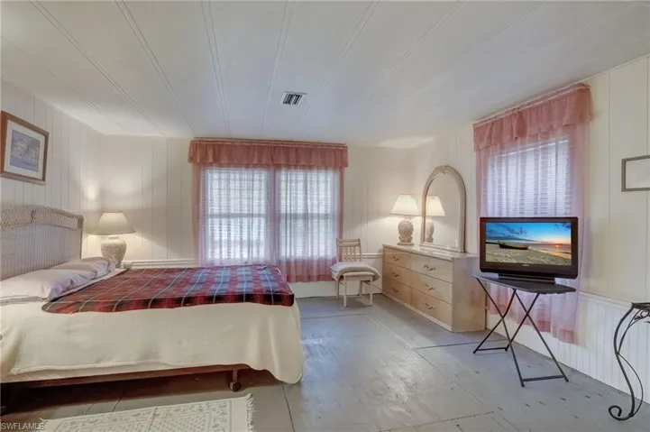 Owners Bedroom with light wood-style flooring