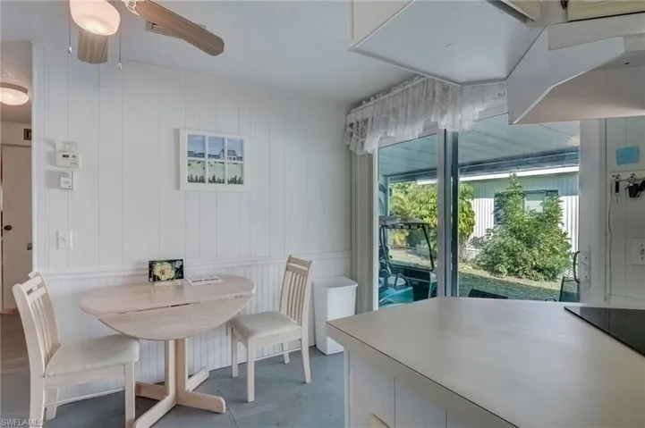Dining room with finished concrete floors and ceiling fan