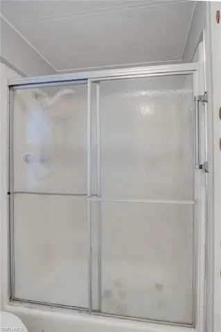 Full bathroom with a shower stall