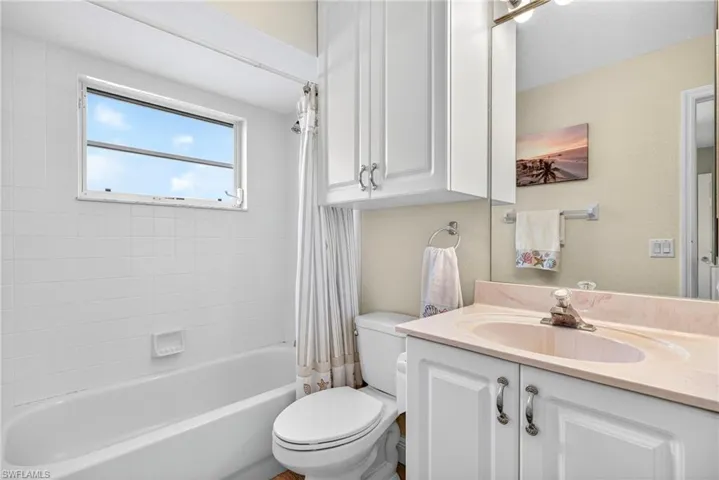 main guest bathroom with door into guest bedroom