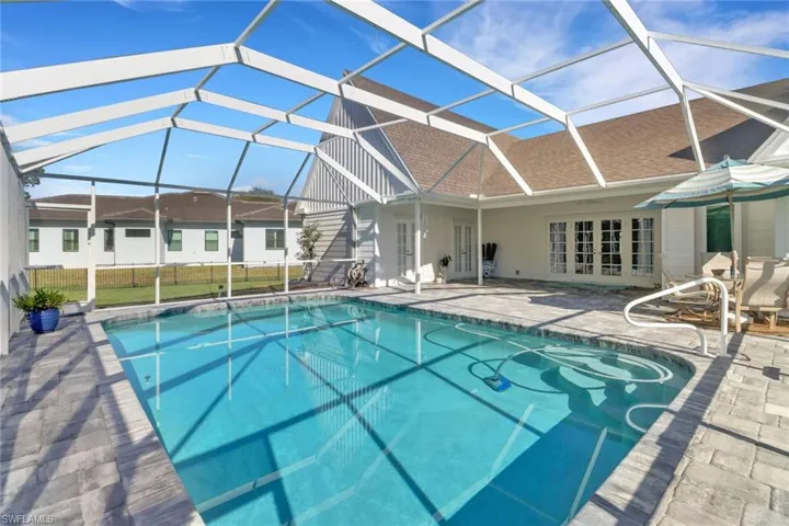 View of pool with a patio area, a lanai, and french doors
