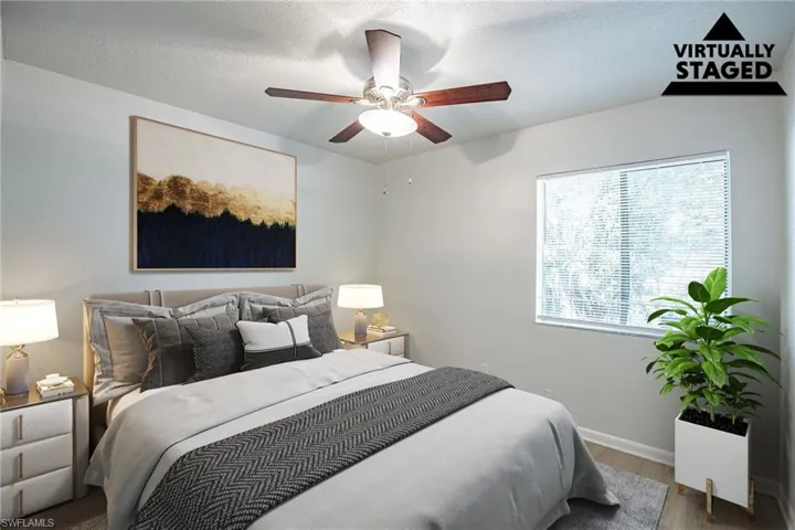 Bedroom featuring wood finished floors and a ceiling fan