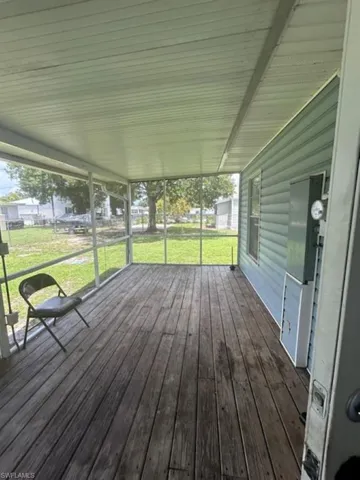 Wooden terrace with a lawn