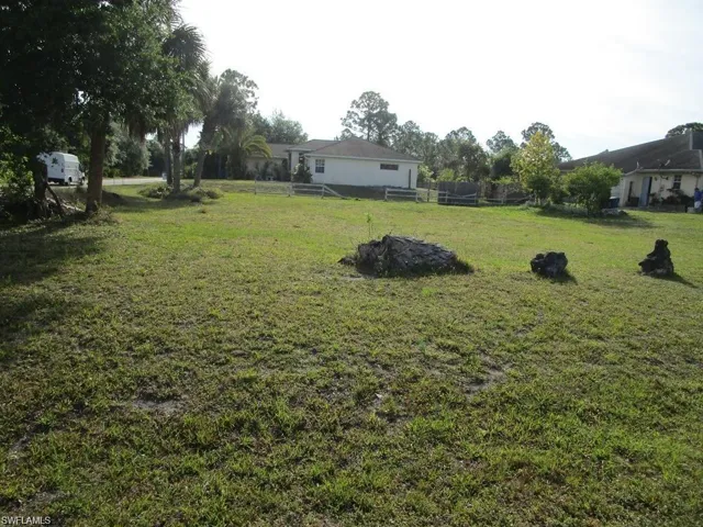 View of yard featuring fence