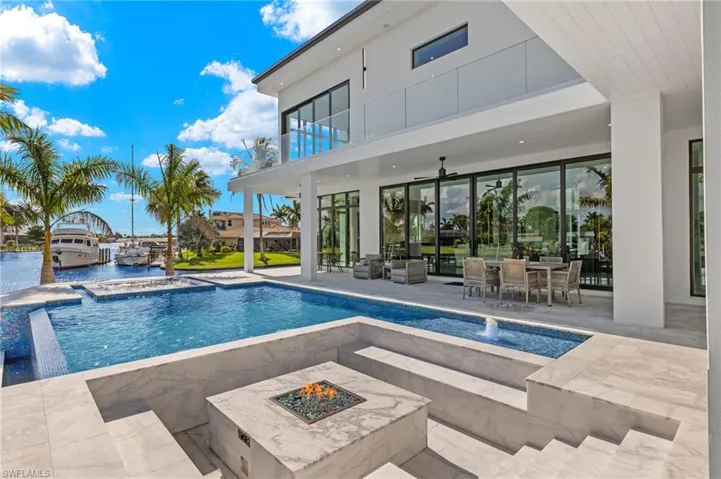 Fire pit attached to the pool for entertaining
