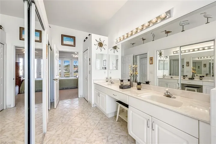owners suite, dual closets, dual sinks with vanity area