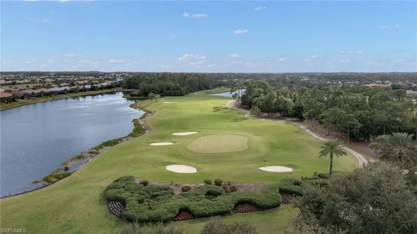 Aerial view of a nearby body of water and a local golf course